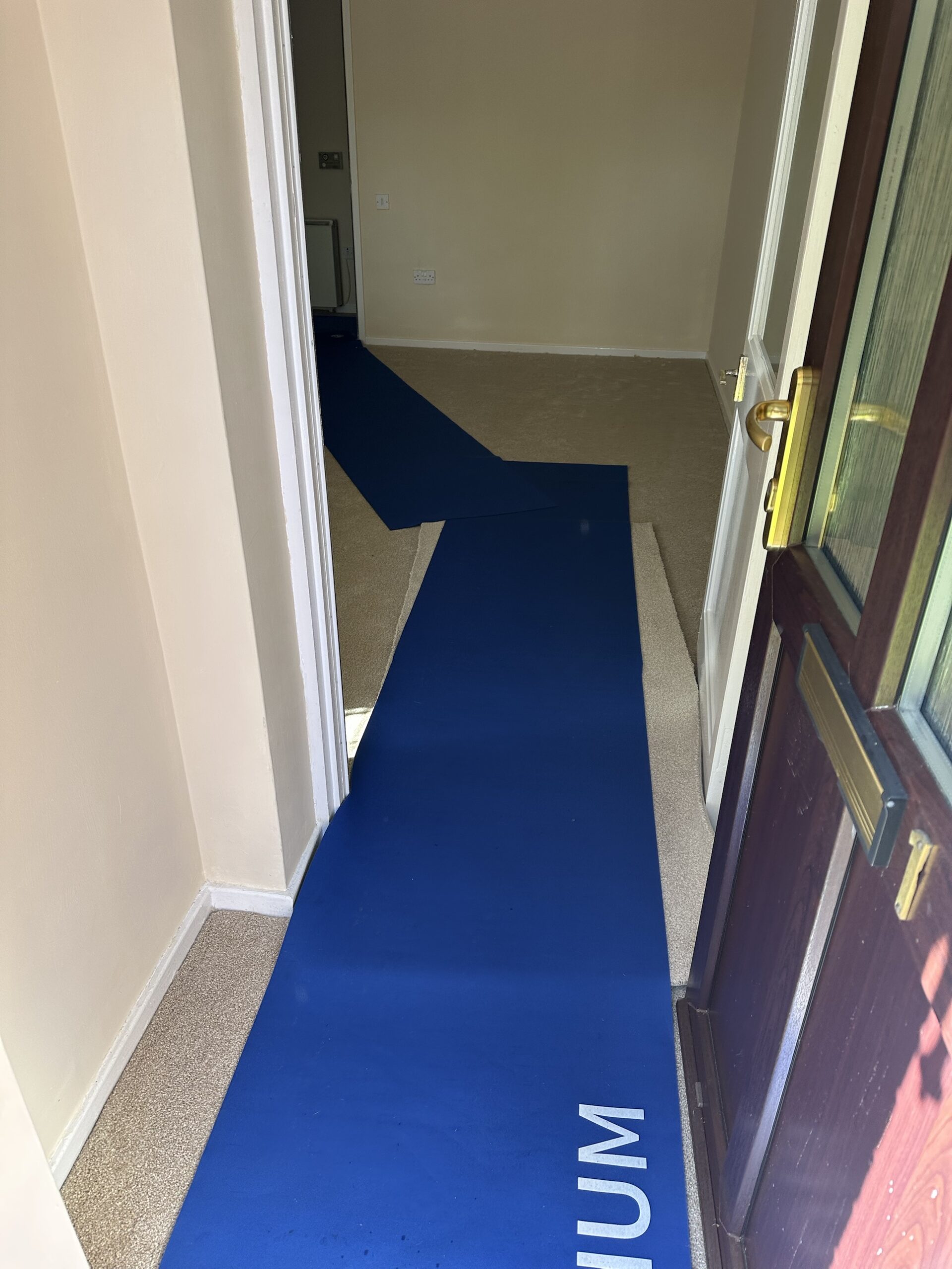 Floor protection runner laid through the hallway to protect flooring during the move