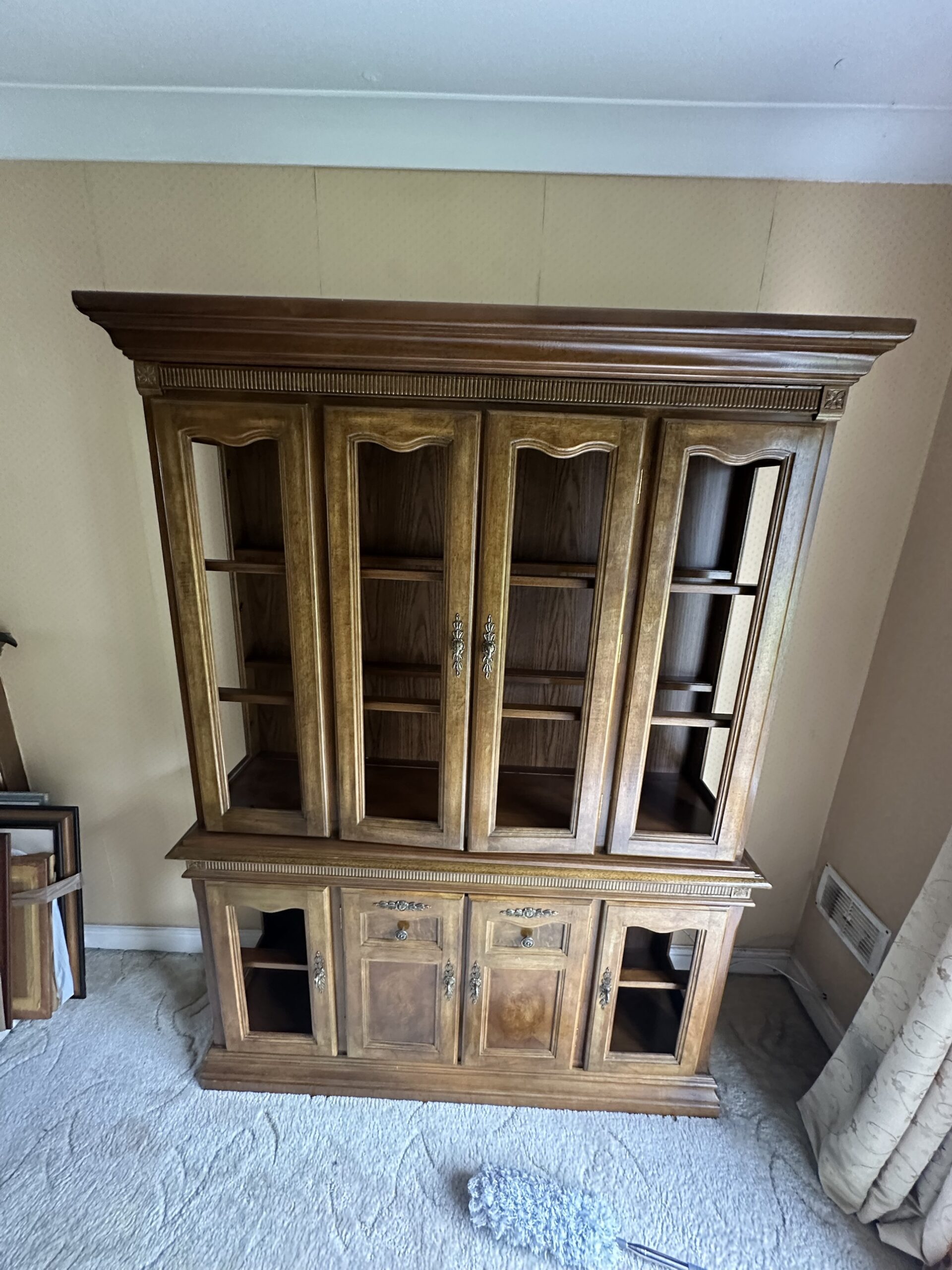 Glass-door china cabinet delivered safely and placed in the new living room