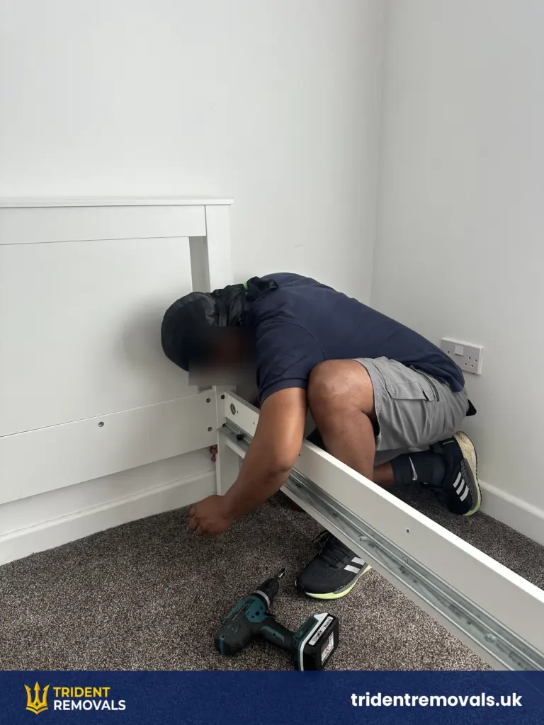 Bed frame being reassembled in the new flat in Allerton after the move