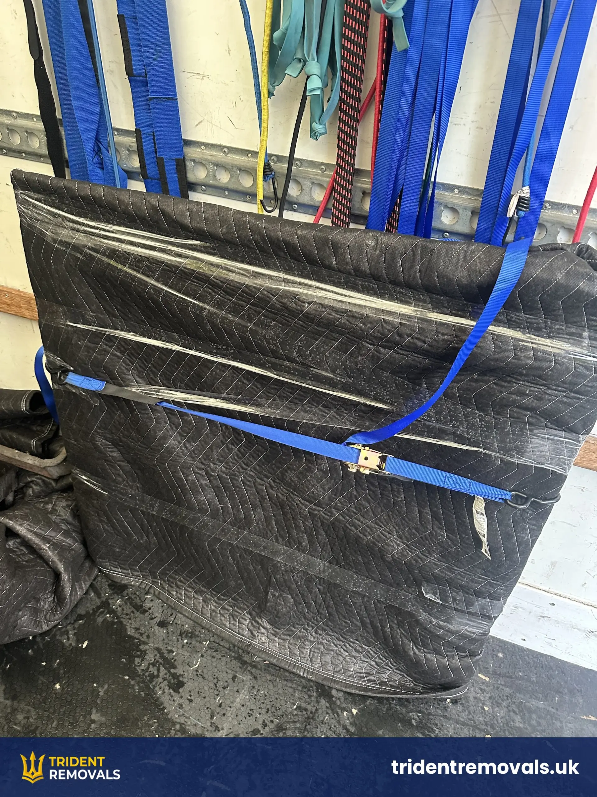 House Removal Bromborough to Wavertree: Cast Iron Fireplace and Upstairs Move Reliable Removals and House Clearance in Liverpool Heavy cast iron fireplace wrapped and ratchet-strapped in the van