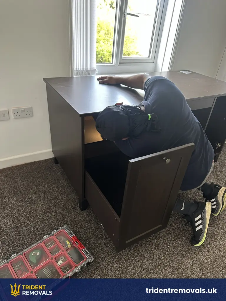 Desk being reassembled in a new flat in Allerton, Liverpool