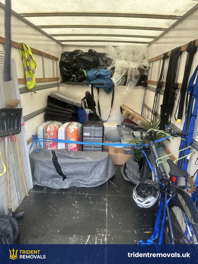 Suitcases, a bike and boxes strapped in the Luton van for a move to Salford Quays