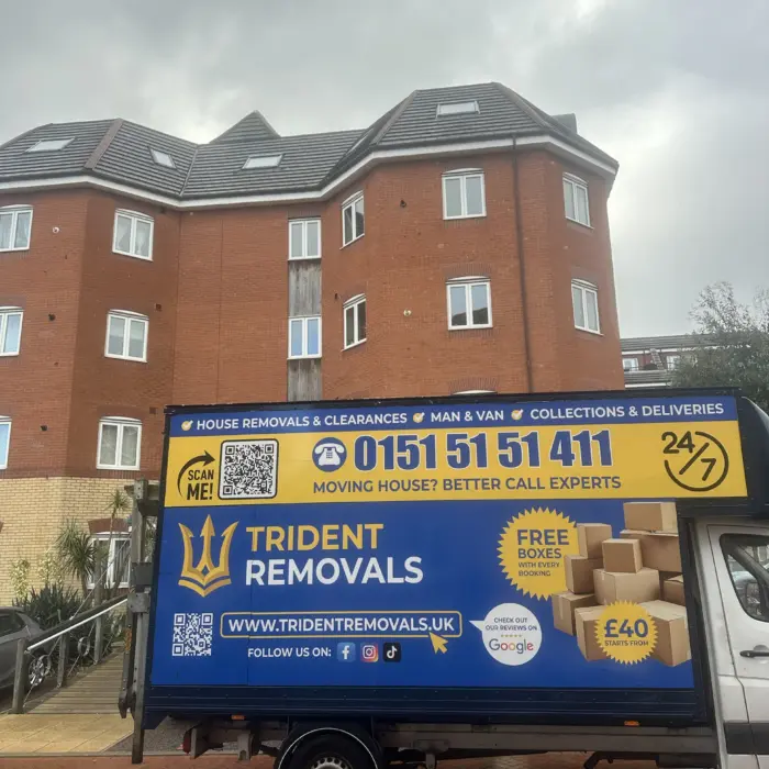 Trident Removals Luton van outside flats on the Liverpool waterfront