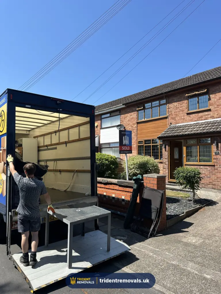 Removals team loading table tail lift in Liverpool – Trident Removals