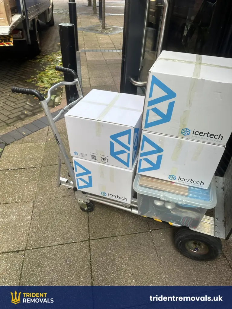 Boxes on a trolley at the entrance of a Salford Quays apartment building