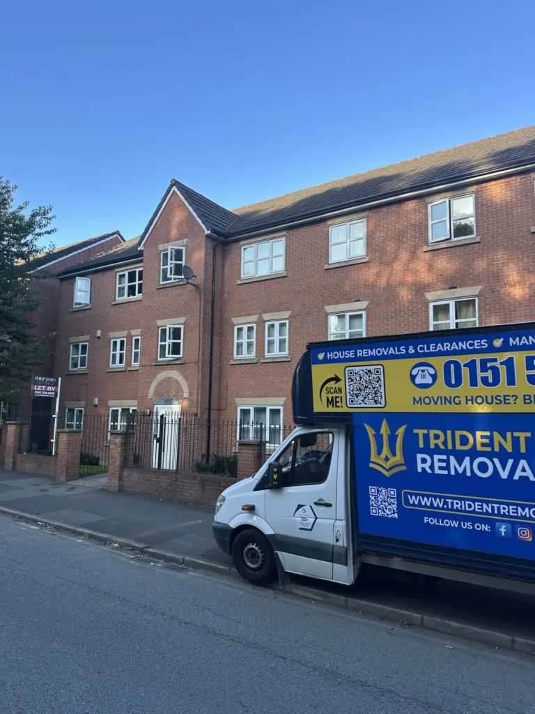 Home Reliable Removals and House Clearance in Liverpool Trident Removals van outside a block of flats in Liverpool